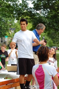 Joseph Hall rallying the crowd before the 5K